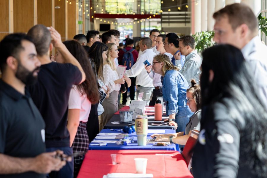 Recruiters speak with students at the career fair in the A. Ray Olpin University Union in Salt Lake City, Utah on Sept. 20, 2022. (Photo by Xiangyao Axe Tang | The Daily Utah Chronicle)