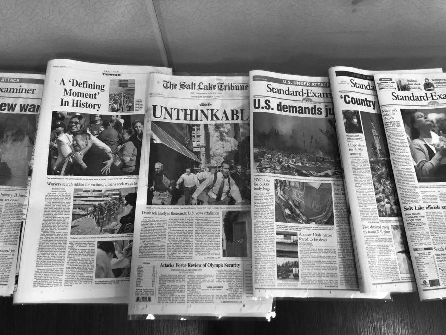 Newspapers published in the days following 9/11, at Emerald Projects event on Sept. 11, 2022. (Photo by Kayleigh Silverstein | The Daily Utah Chronicle)