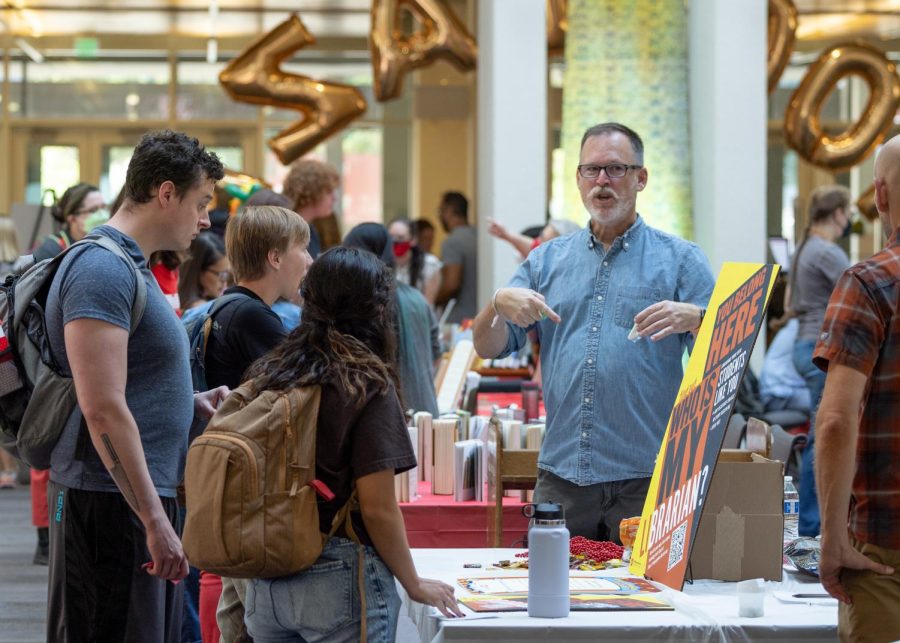 Librarian Dale Larsen speaks to students about opportunities to work with librarians at the Hooplaza event which took place at the Marriott Library on campus on Sept 8, 2022.  (Photo by Jack Gambassi | The Daily Utah Chronicle)