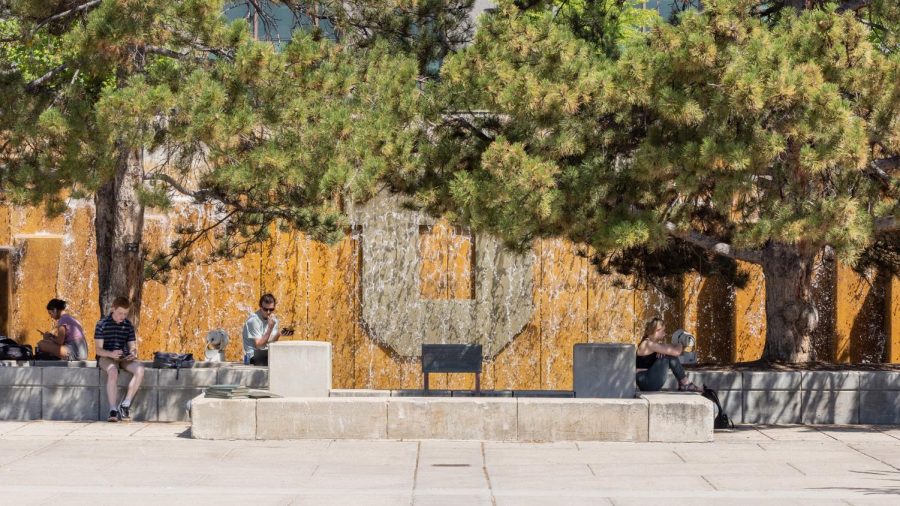Students find some respite from the heat on 
the University of Utah campus outside the Marriott Library on Tuesday, Sept. 6, 2022. (Photo by Jack Gambassi | The Daily Utah Chronicle)