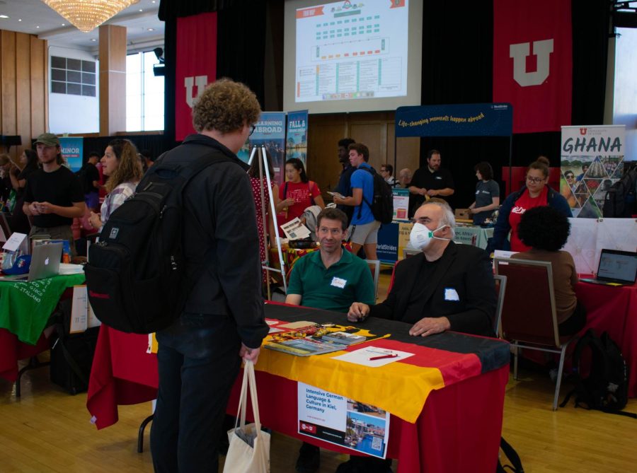 A University of Utah student getting information at one of the many stands at the Learning Abroad Fair on Oct. 5, 2022.