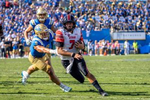 Utah Football Quarterback, Cam Rising (#7), makes a 9-yard TD run in the game vs. UCLA on Oct. 8, 2022 at the Rose Bowl in Pasadena, CA. (Photo By Jack Gambassi | The Daily Utah Chronicle)