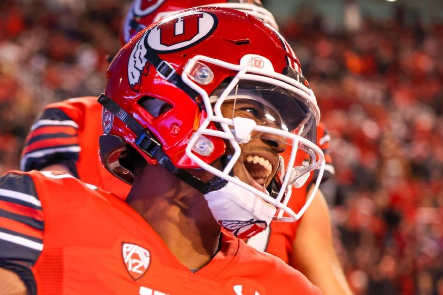 University of Utah’s Nate Johnson (#13) celebrates after scoring a touchdown in the game vs. Arizona at Rice-Eccles Stadium on campus on Nov. 5, 2022.