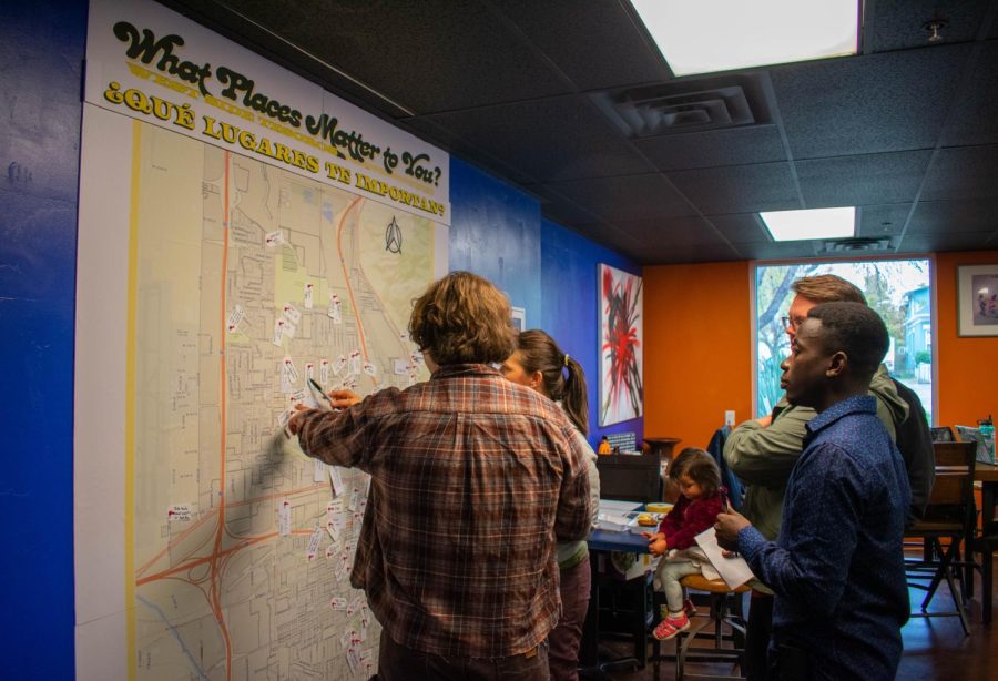 Salt Lake City locals add places that matter to them on a map of the West Side of Salt Lake City at Mestizo Coffeehouse in Salt Lake City on Saturday, Nov. 5, 2022.