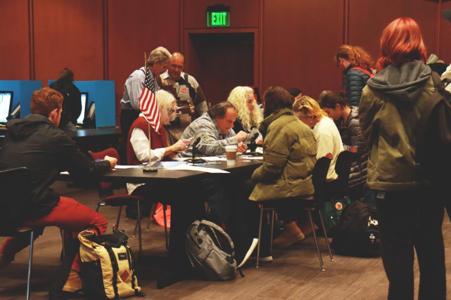 Voting poll workers help students fill out and turn in their election ballots in Marriott Library at University of Utah in Salt Lake City on Tuesday, Nov. 8, 2022.