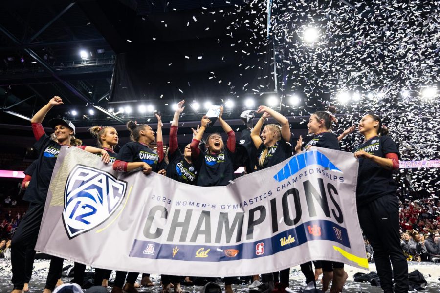 Utah Red Rocks lift the trophy after winning the Pac-12 Women’s Gymnastics Champions title at Maverik Center in West Valley City, Utah on Saturday, March 18, 2023. (Photo by Xiangyao “Axe” Tang | The Daily Utah Chronicle)