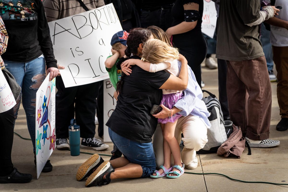 A+child+hugs+a+protestor+at+the+protest+of+the+potential+overturn+of+Roe+V.+Wade+at+the+Utah+State+Captiol+on+May+5%2C+2022.+%28Photo+by+Xiangyao+Tang+%7C+The+Daily+Utah+Chronicle%29