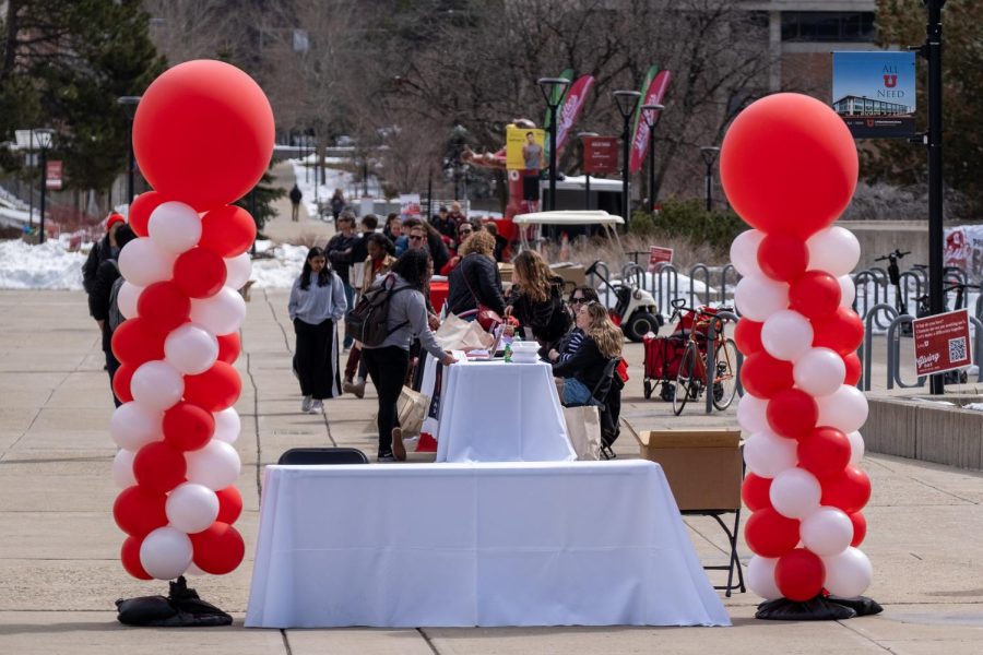 Giving Day tables in front of the J. Willard Marriott Library in Salt Lake City on Tuesday, March 28, 2023.