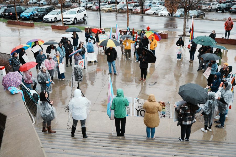 Students gather outside of the J. Willard Marriott Library to protest the event held by the Young Americans for Freedom at the University of Utah in Salt Lake City on Friday, April 21, 2023. (Photo by Xiangyao Axe Tang | The Daily Utah Chronicle)