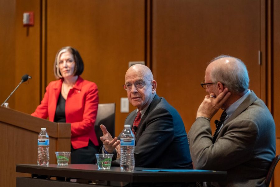 Amos Guiora (middle) speaking alongside Hollis Robbins (left) and Bob Goldberg (right) during the Holocaust Memorial Day discussion panel at the Gould Auditorium in Salt Lake City on Tuesday, April 18, 2023.