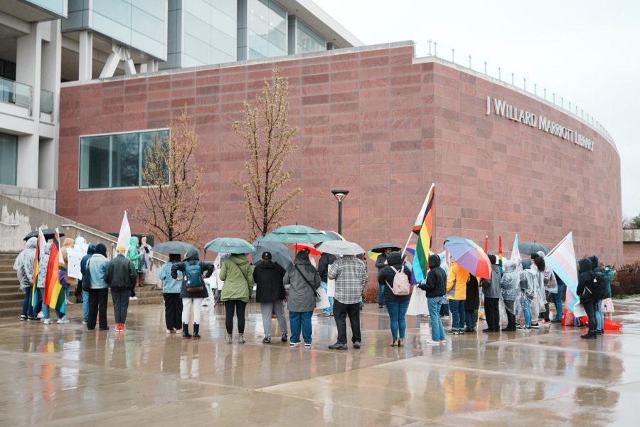 Students gather outside of the J. Willard Marriott Library to protest the event held by the Young Americans for Freedom (YAF) at the University of Utah in Salt Lake City on April 21, 2023.