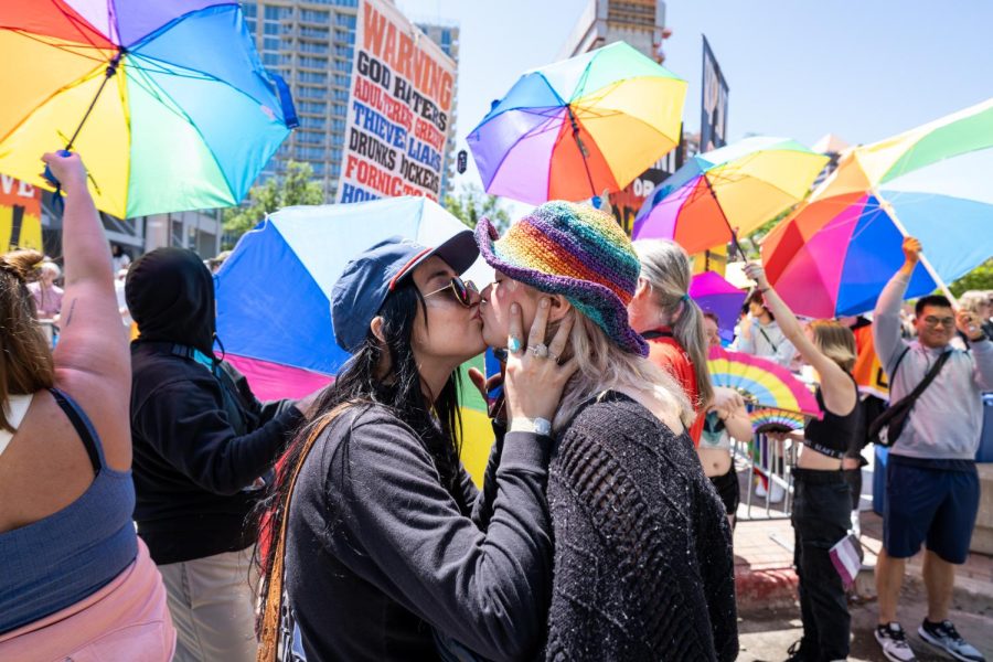 Two+parade-goers+kissing+in+front+of+the+Official+Street+Preachers+at+the+2023+Utah+Pride+Parade+in+downtown+Salt+Lake+City+on+Sunday%2C+June+4%2C+2023.