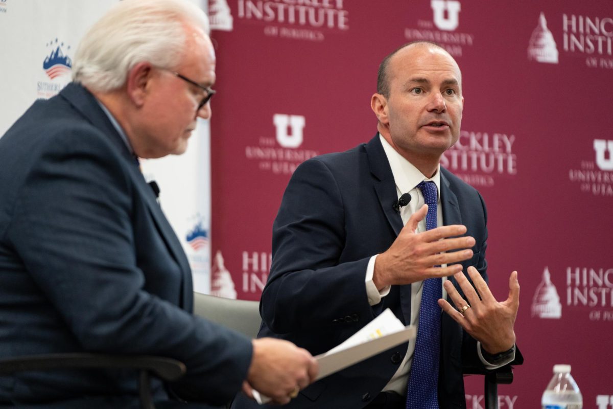 Sen. Mike Lee speaking next to Rick Larsen during the Sutherland Institutes 2023 Congressional Series, held at the Hinckley Institute of Politics on the University of Utah campus in Salt Lake City on Tuesday, Aug. 22, 2023. (Photo by Xiangyao Axe Tang | The Daily Utah Chronicle)