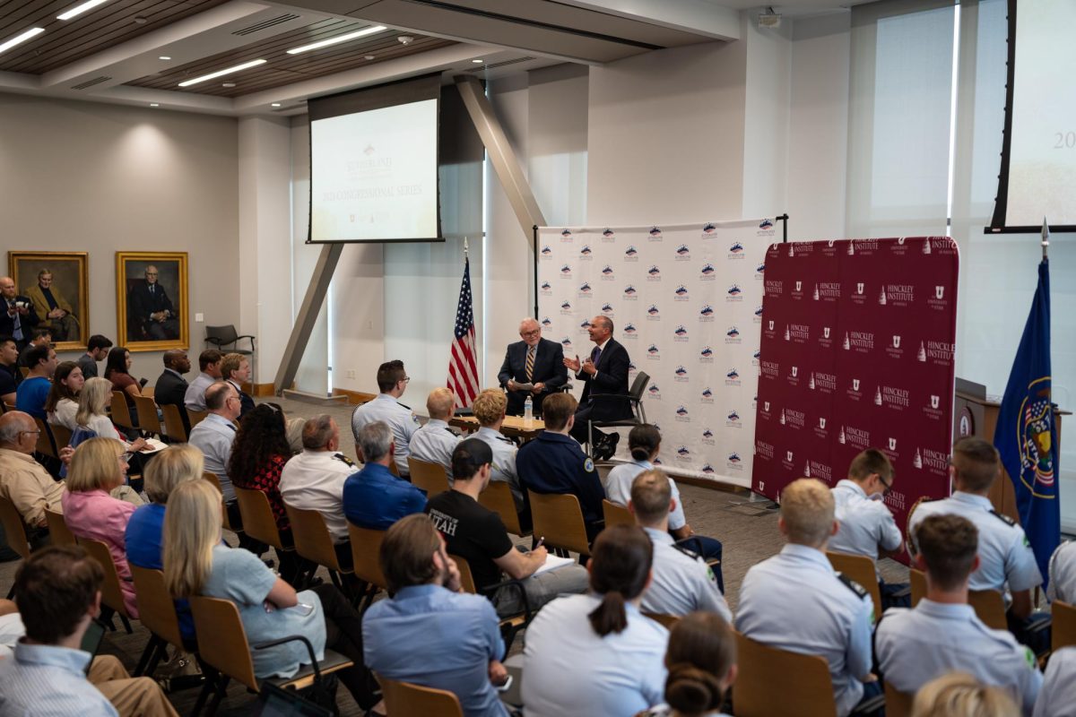 Sen. Mike Lee speaking next to Rick Larsen during the Sutherland Institutes 2023 Congressional Series at Hinckley Institute of Politics on the University of Utah campus in Salt Lake City, Tuesday, Aug. 22, 2023. (Photo by Xiangyao Axe Tang | The Daily Utah Chronicle)
