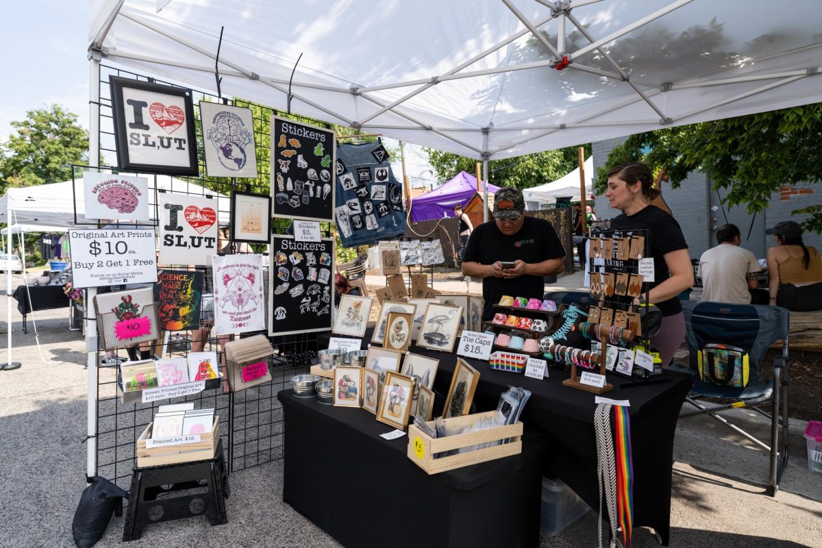 Kristi Sahagun and Derek Sahagun in their booth at the SLC Punk Rock Flea Market at the Lost Acorn Gallery in Salt Lake City on July 30, 2023. (Photo by Xiangyao Axe Tang | The Daily Utah Chronicle)