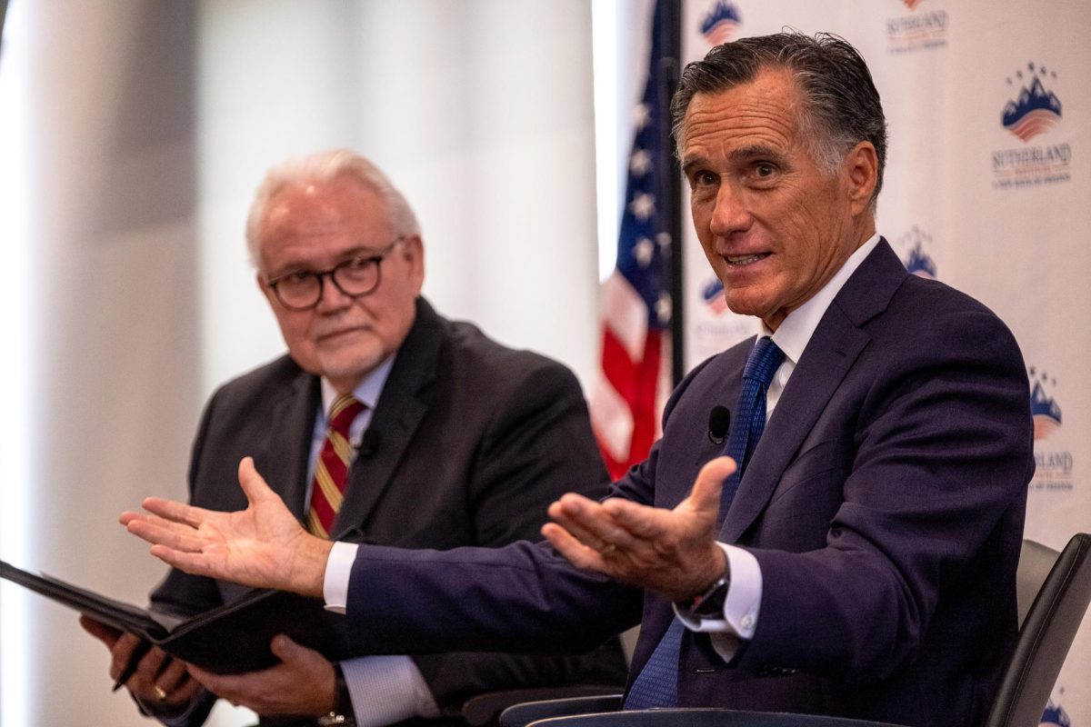 Sen. Mitt Romney speaking next to Rick Larsen during the Sutherland Institutes 2023 Congressional Series at Hinckley Institute of Politics on the University of Utah campus in Salt Lake City, Monday, Aug. 21, 2023. (Photo by Marco Lozzi | The Daily Utah Chronicle)