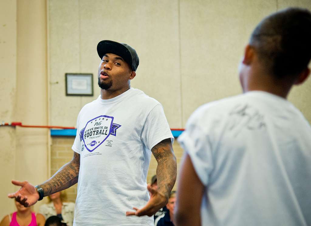 Baltimore Ravens’ wide receiver, Steve Smith, answers questions from attendees during the two-day children’s football camp June 24 at Eglin Air Force Base, Fla. (Courtesy of jenikirbyhistory)