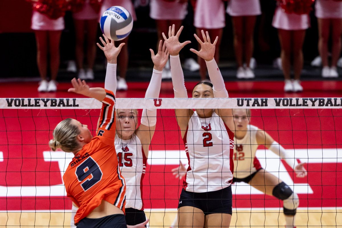 Utah setter Grace Hammond (15) and middle blocker Emrie Satuala (2) in the game versus the Oregon State Beavers at Jon M. Huntsman Center in Salt Lake City on Friday, Oct. 06, 2023. (Photo by Xiangyao “Axe” Tang | The Daily Utah Chronicle)