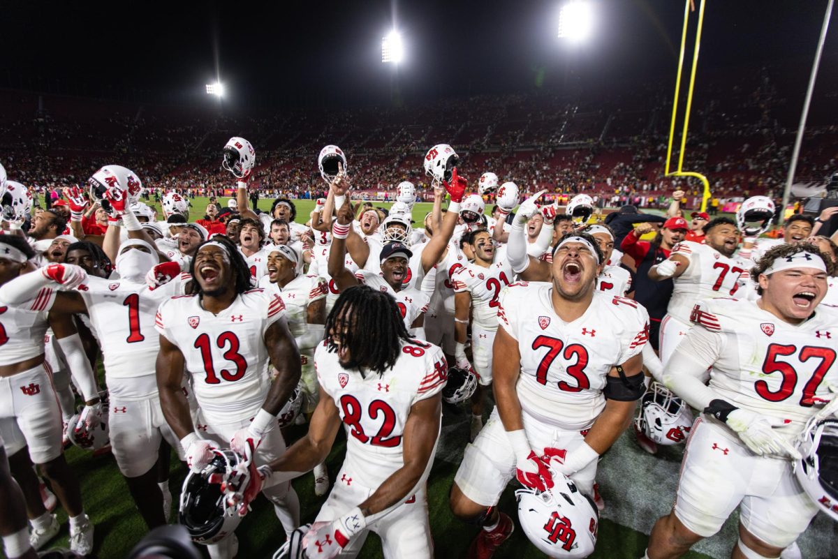 The Utah Utes celebrate after defeating the USC Trojans at the Los Angeles Memorial Coliseum in Los Angeles, CA on Saturday, Oct. 21, 2023. (Photo by Xiangyao “Axe” Tang | The Daily Utah Chronicle)