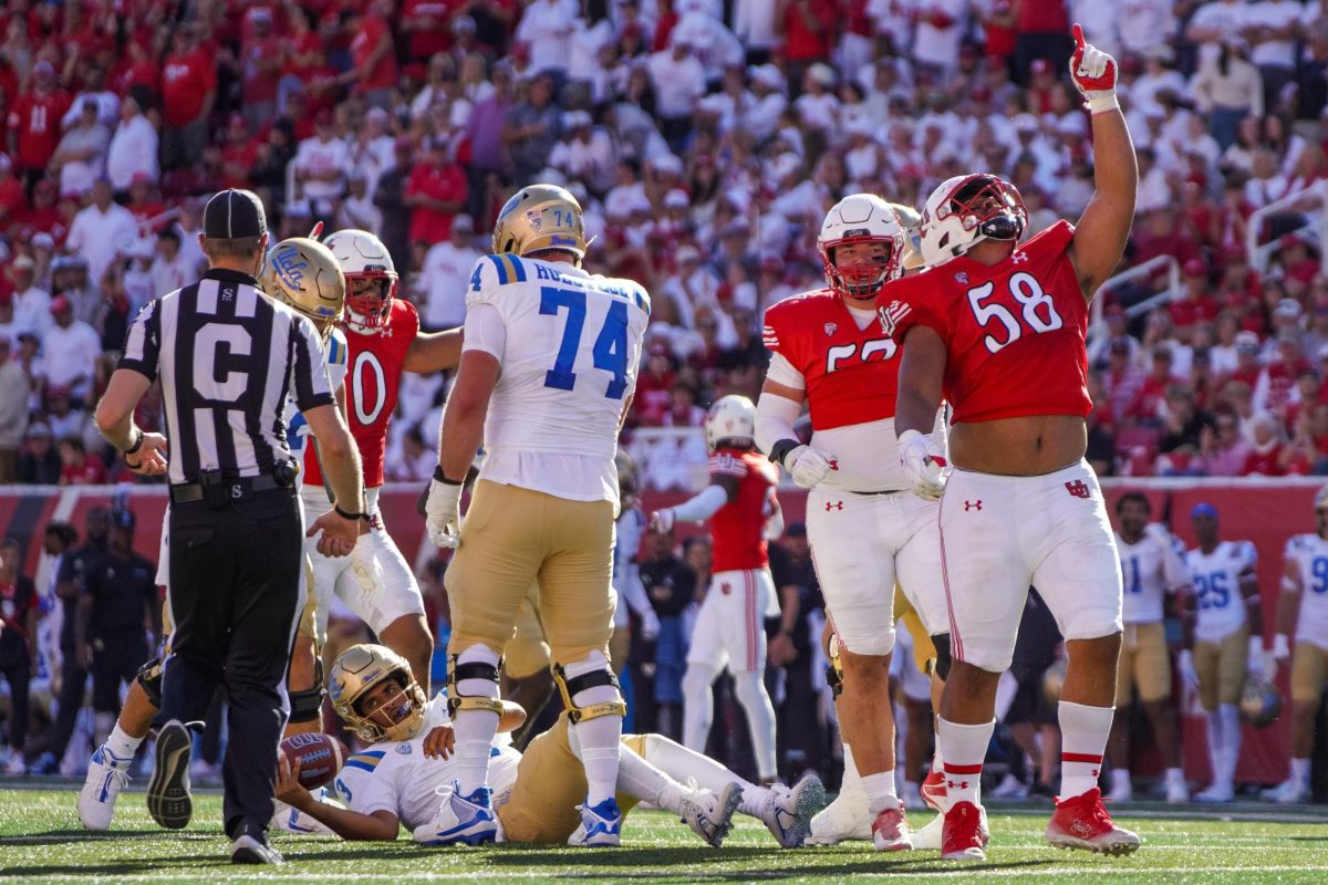 The Utah Utes celebrate after a sack versus the UCLA Bruins at Rice-Eccles Stadium in Salt Lake City on Saturday, Sept.23, 2023. (Photo by Xiangyao “Axe” Tang | The Daily Utah Chronicle)