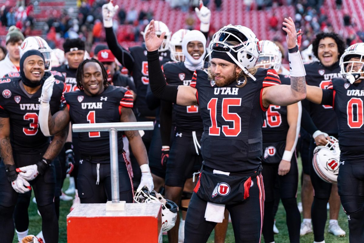 The Utah Utes celebrate the win versus the Colorado Buffalos at Rice-Eccles Stadium in Salt Lake City on Saturday, Nov. 25, 2023. (Photo by Xiangyao “Axe” Tang | The Daily Utah Chronicle)