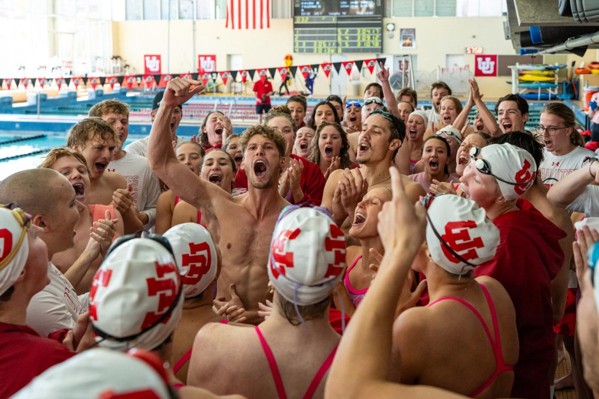 The University of Utah swimming and diving team celebrates after defeating the LSU Tigers at Ute Natatorium in Salt Lake City on Saturday, Oct. 07, 2023. (Photo by Xiangyao “Axe” Tang | The Daily Utah Chronicle)