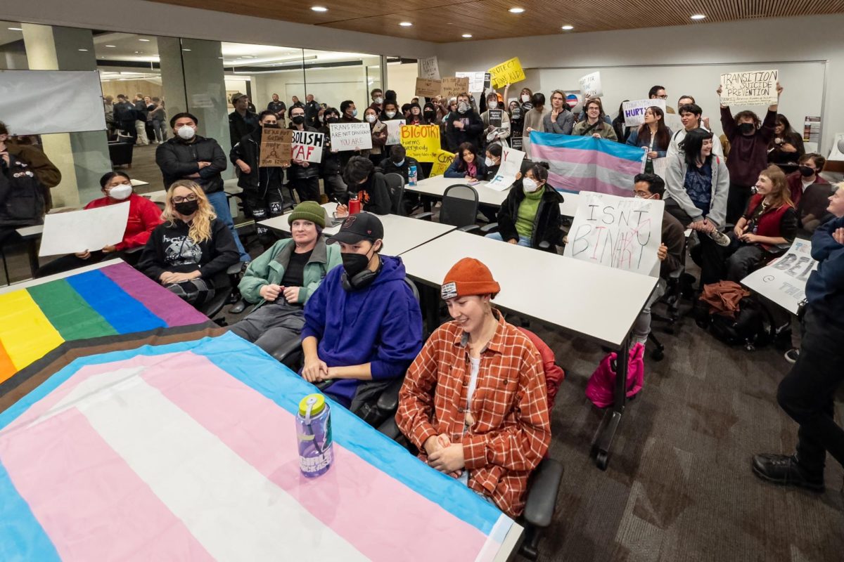 Demonstrators at the Young Americans for Freedom at the University of Utah’s watch party in J. Willard Marriott Library in Salt Lake City on Wednesday, Nov. 01, 2023. (Photo by Xiangyao “Axe” Tang | The Daily Utah Chronicle)