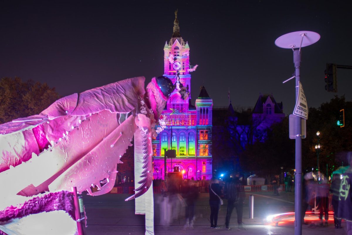 Large+pink+praying+mantis+puppet+in+front+of+the+City+and+County+Building+at+ILLUMINATE+Creative+Art+%2B+Tech+Festival+on+Friday%2C+Nov.+10%2C+2023.+%28Photo+by+A