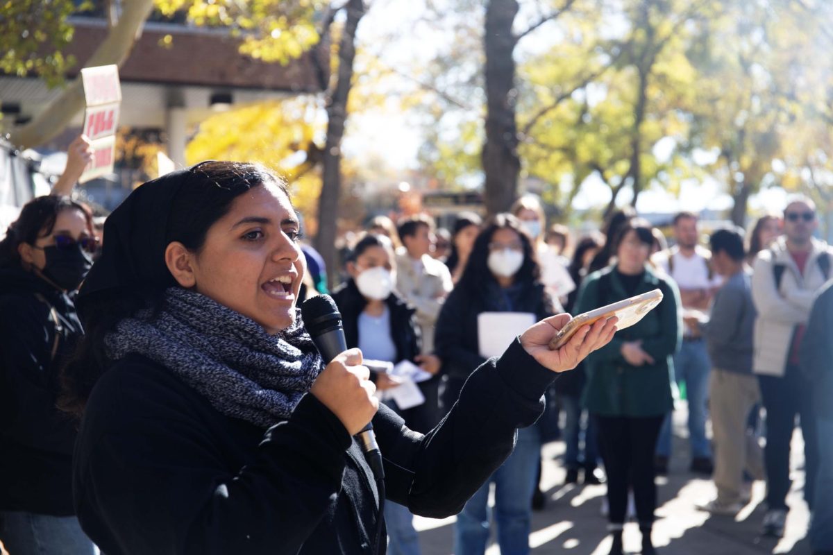 Mecha organizer Gabriela Merida recites a poem written by a Palestinian woman as part of a Mecha walk-out in front of the A. Ray Olpin Student Union Building in Salt Lake City on Thursday, Nov. 9, 2023. (Photo by Sarah Karr | The Daily Utah Chronicle)