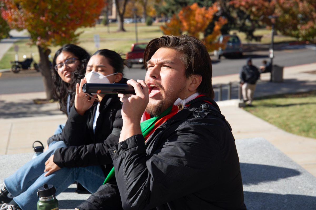 Julio Irungaray, an organizer for Mecha, leads a chant for Palestine in front of the John R. Park Building in support of Palestine in Salt Lake City on Thursday, Nov. 9 2023. (Photo by Sarah Karr | The Daily Utah Chronicle)
