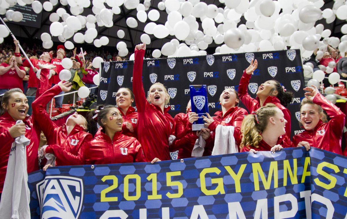 The Utah gymnastics team celebrates on the podium after winning the PAC-12 Gymnastics Championship at the Jon M. Huntsman Center on March 21, 2015. (Photo by Chris Samuels | The Daily Utah Chronicle)