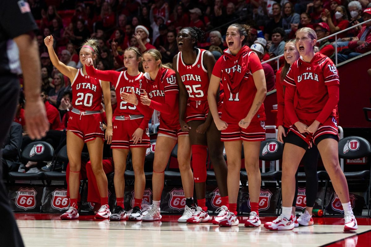 The+Utah+women%E2%80%99s+basketball+team+celebrates+after+scoring+against+the+BYU+Cougars+at+the+Jon+M.+Huntsman+Center+in+Salt+Lake+City+on+Saturday%2C+Dec.+2%2C+2023.+%28Photo+by+Xiangyao+%E2%80%9CAxe%E2%80%9D+Tang+%7C+The+Daily+Utah+Chronicle%29