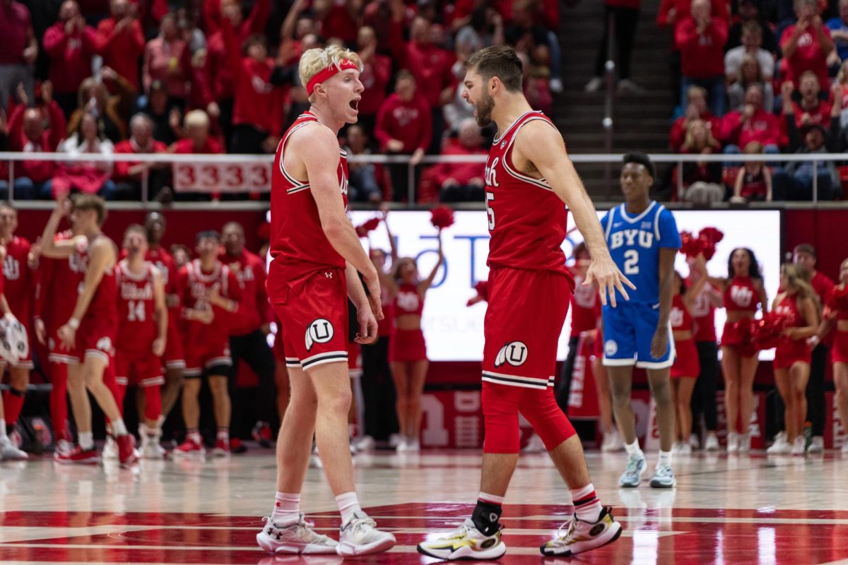 The Runnin’ Utes celebrate versus the BYU Cougars at the Jon M. Huntsman Center in Salt Lake City on Dec. 9, 2023. (Photo by Xiangyao “Axe” Tang | The Daily Utah Chronicle)