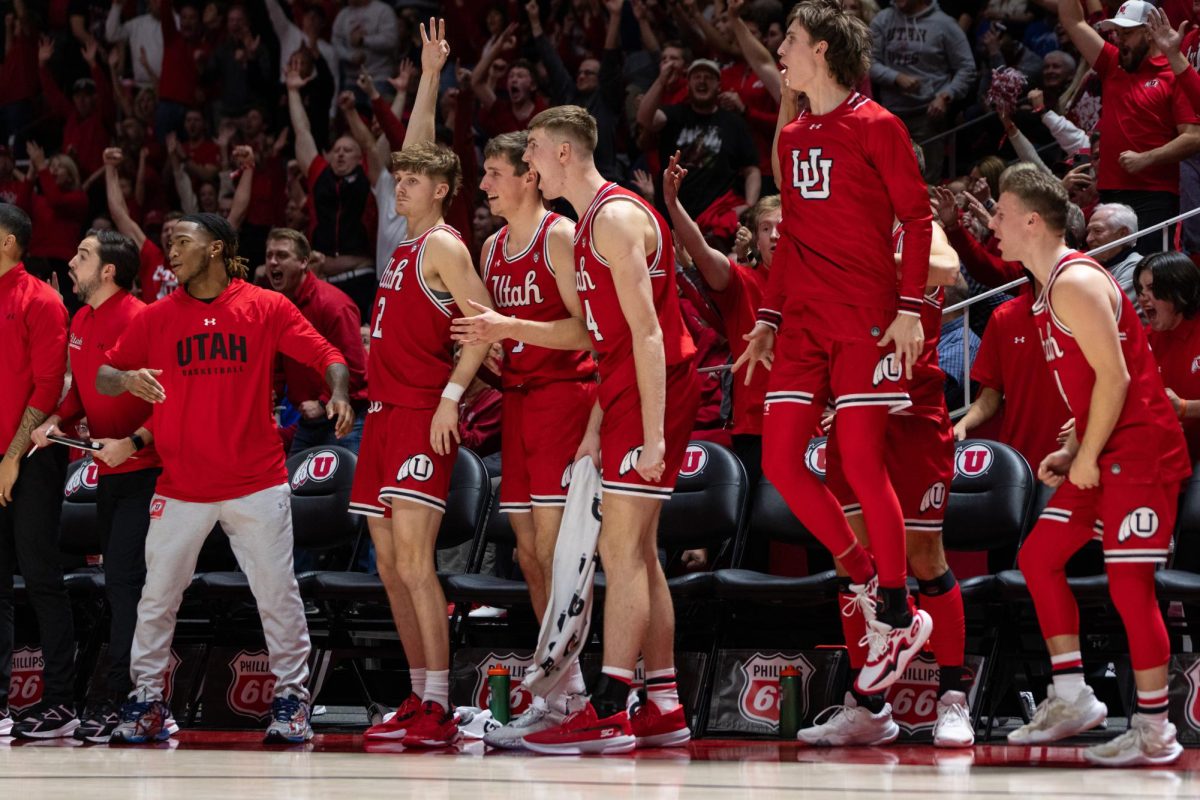 The Runnin’ Utes celebrate versus the BYU Cougars at Jon M. Huntsman Center in Salt Lake City on Saturday, Dec. 09, 2023. (Photo by Xiangyao “Axe” Tang | The Daily Utah Chronicle)