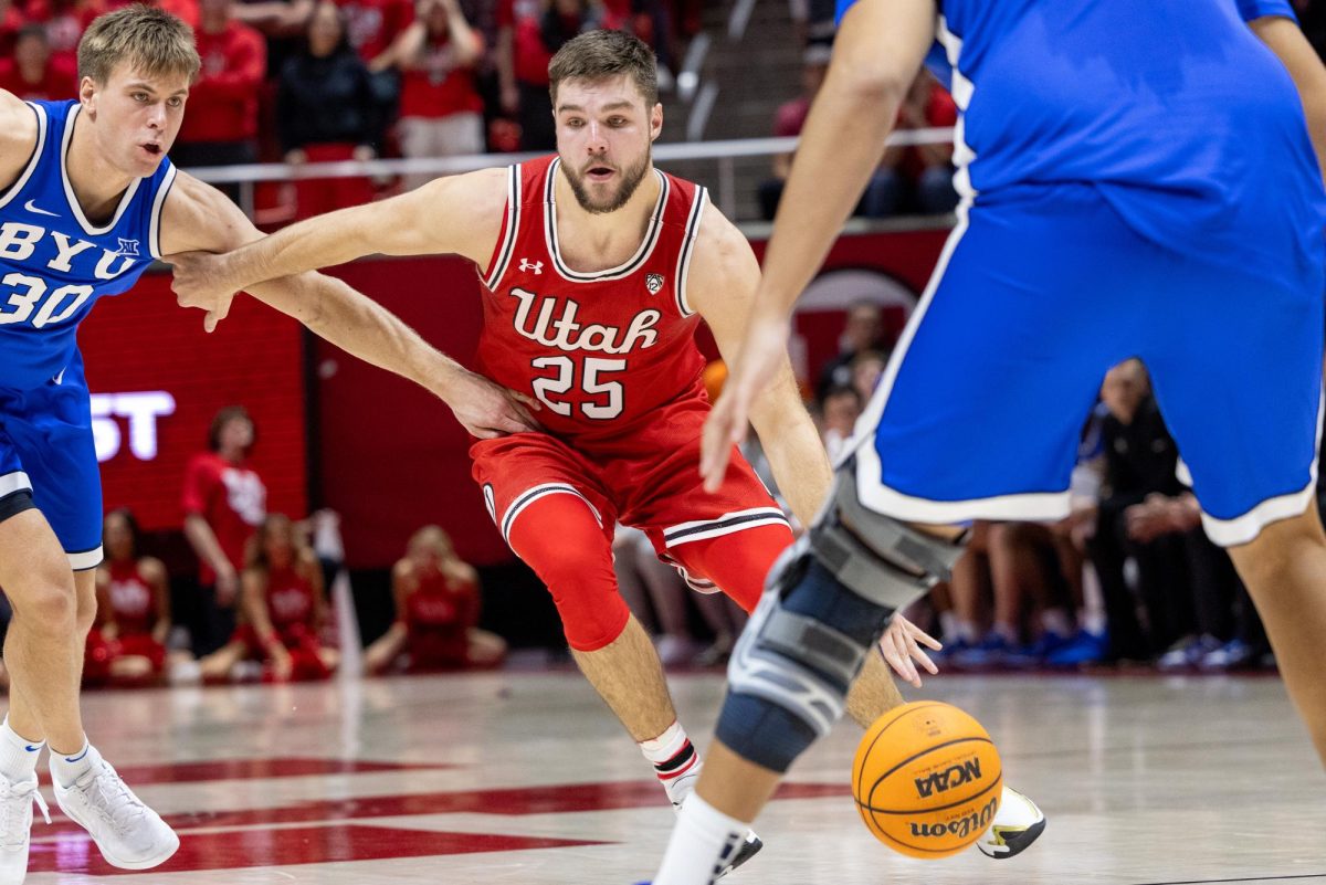 Utah guard Rollie Worster (25) versus the BYU Cougars at the Jon M. Huntsman Center in Salt Lake City on Saturday, Dec. 9, 2023. (Photo by Mary Allen | The Daily Utah Chronicle)