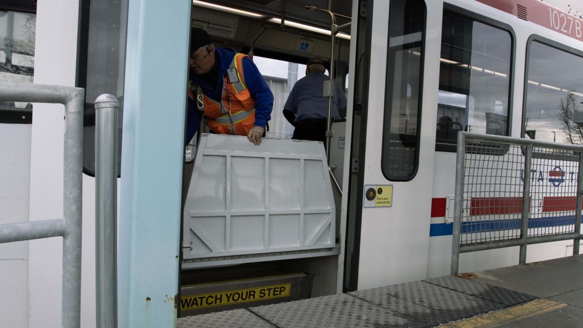Blue Line TRAX driver pulls back the accessibility ramp after boarded passengers at Millcreek Station in Millcreek, Utah on Dec. 4, 2023. (Photo by Sarah Karr | The Daily Utah Chronicle) 