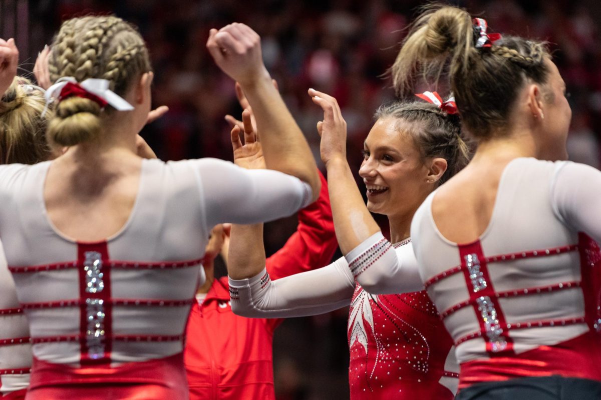 Utah gymnast Grace McCallum celebrates with her teammates after her floor routine versus the Arizona State Sun Devils at Jon M. Huntsman Center in Salt Lake City on Friday, Jan. 26, 2024. (Photo by Xiangyao “Axe” Tang | The Daily Utah Chronicle)