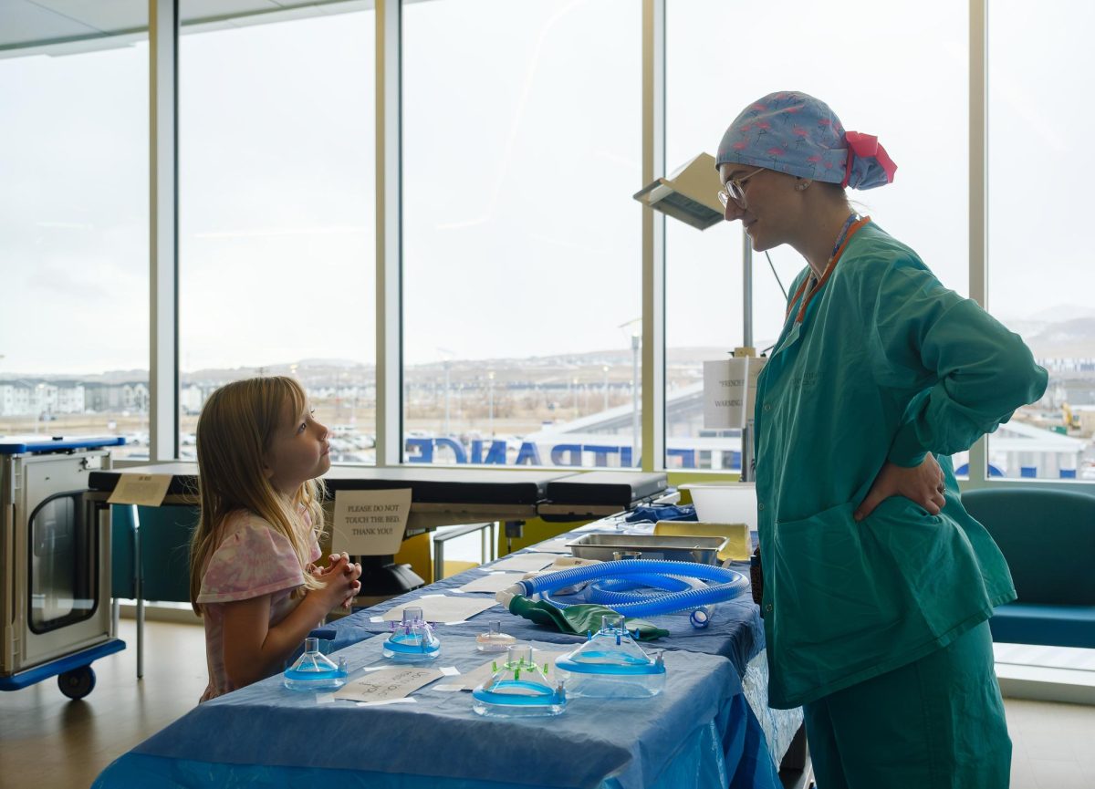 A medical professional and a child smile at each other at the new Primary Children’s Hospital, Miller Family Campus in Lehi, Utah on Saturday, Feb. 3, 2024. (Photo by Marco Lozzi | The Daily Utah Chronicle)