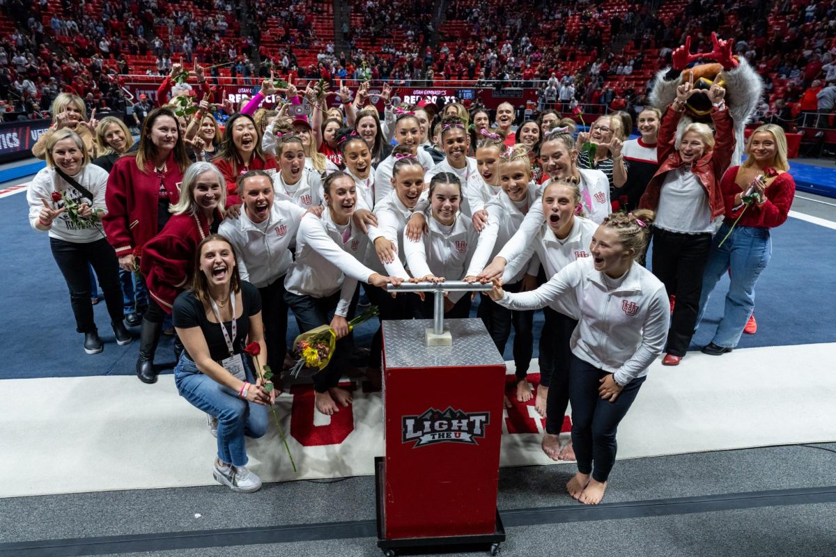 The Utah Red Rocks and former Utah gymnasts light the U after defeating the Stanford Cardinal at the Jon M. Huntsman Center in Salt Lake City on Friday, Feb. 23, 2024. (Photo by Xiangyao “Axe” Tang | The Daily Utah Chronicle)