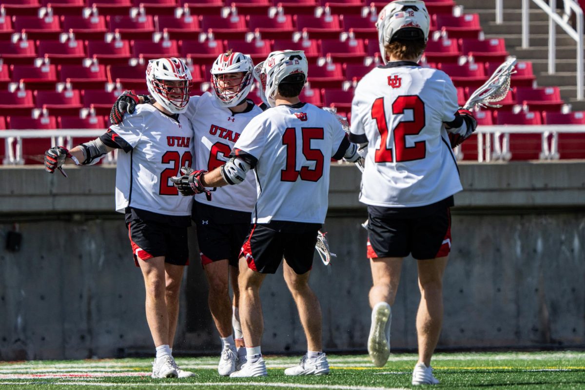 The Utah men’s lacrosse celebrates after scoring against the University of Vermont Catamounts at Rice-Eccles Stadium in Salt Lake City on Saturday, Feb. 24, 2024. (Photo by Xiangyao “Axe” Tang | The Daily Utah Chronicle)