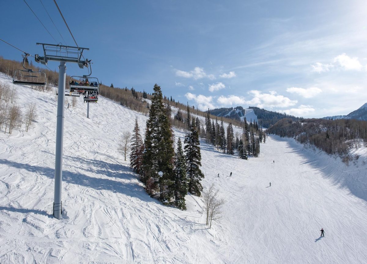 Snowboarders and skiers ride down the Prospector and Detonator trails at Park City Mountain Resort in Park City, Utah on Feb. 23, 2024. (Photo by Marco Lozzi | The Daily Utah Chronicle)