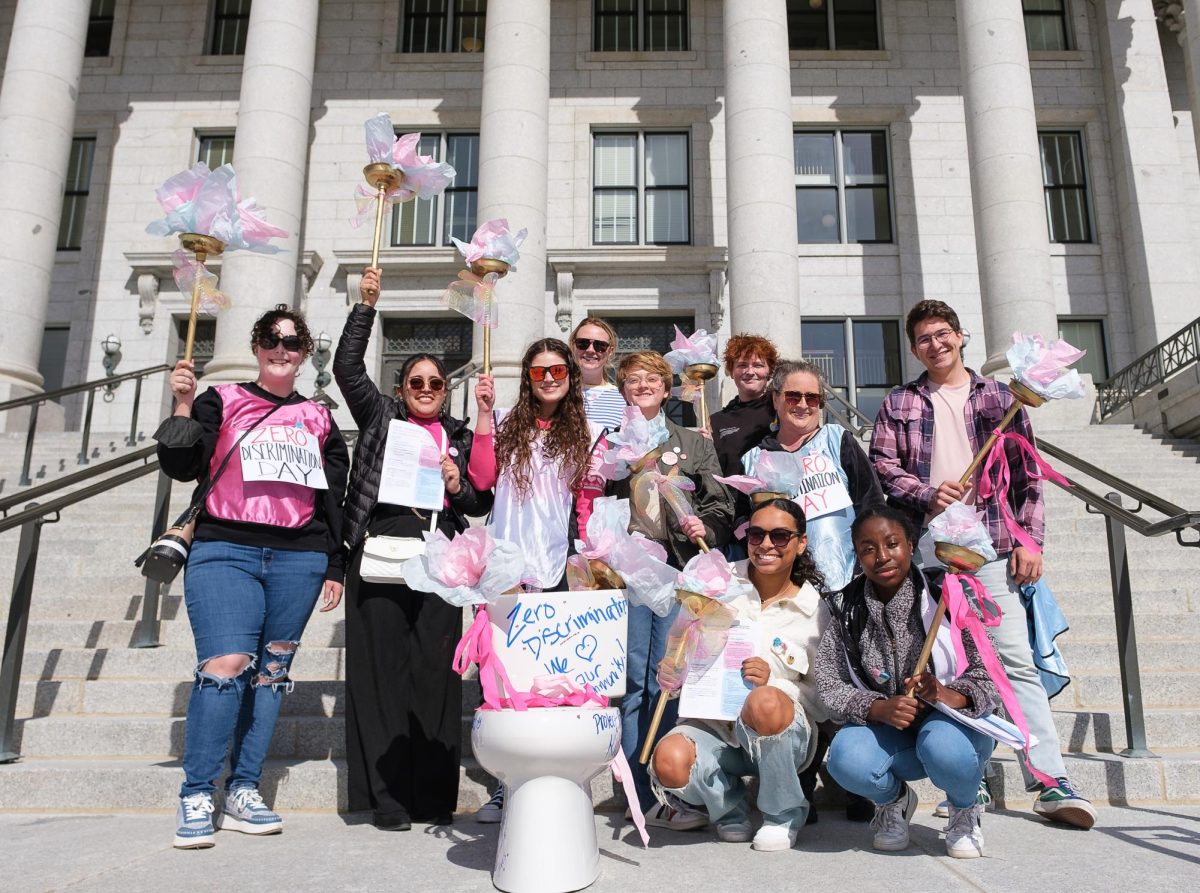 Demonstrators pose for a photo in front of the Utah State Capitol during the Flush out the SHIIT march on Friday, March 1, 2024. (Photo by Marco Lozzi | The Daily Utah Chronicle) 