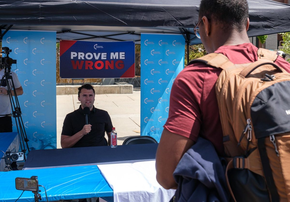 Charlie Kirk responds to a university student during a Turning Point USA debate outside the J. Willard Marriott Library on the University of Utah campus in Salt Lake City on Tuesday, April 23, 2024. (Photo by Marco Lozzi | The Daily Utah Chronicle)