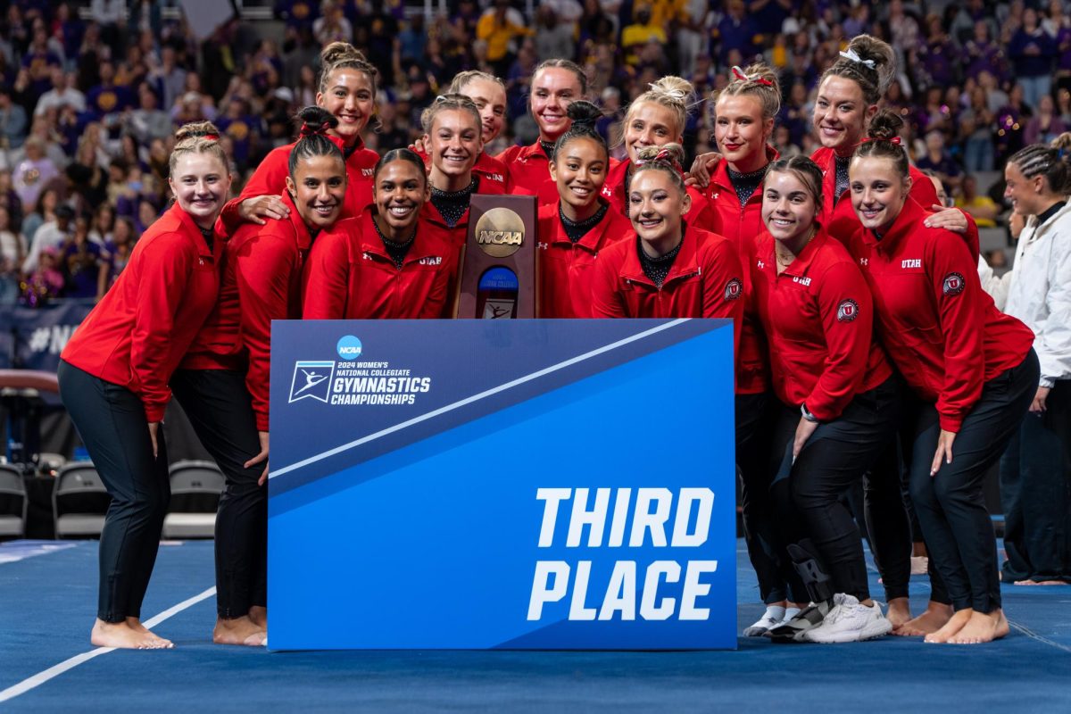 The Utah Red Rocks pose for a photo at the NCAA Gymnastics Championships at Dickies Arena in Fort Worth, TX on Saturday, April 20, 2024. (Photo by Xiangyao “Axe” Tang | The Daily Utah Chronicle)