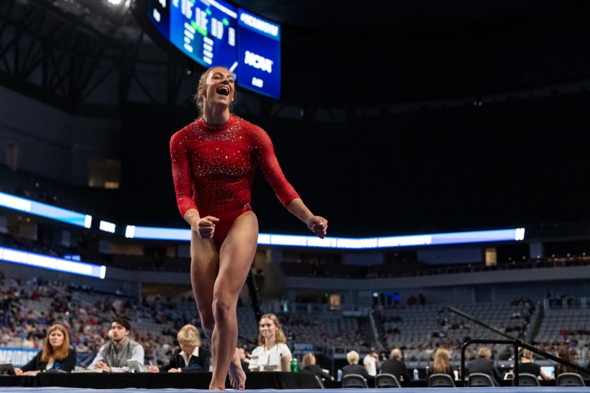 Utah gymnast Grace McCallum celebrates after her beam routine at the NCAA Gymnastics Championships semifinals at Dickies Arena in Fort Worth, TX on Thursday, April 18, 2024. (Photo by Xiangyao “Axe” Tang | The Daily Utah Chronicle)