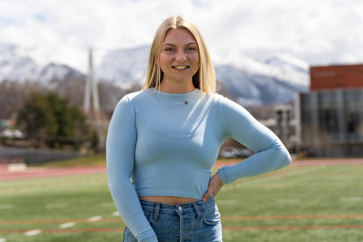 Hannah Haag, copy editor of the Daily Utah Chronicle, poses for a photo at the McCarthey Family Track and Field Complex in Salt Lake City on March 29, 2024. (Photo by Xiangyao “Axe” Tang | The Daily Utah Chronicle)