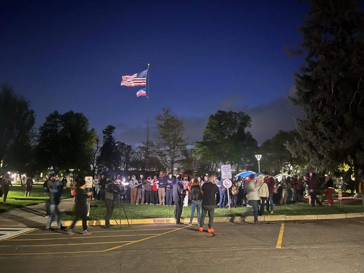 Protestestors on the University of Utah campus form a human chain to protect the encampment in solidarity with Palestine. (Photo by Emerson Hagy | The Daily Utah Chronicle)