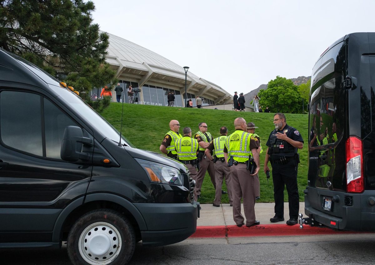 University of Utah police talk to each other in front of the Jon M. Huntsman Center at the University of Utah after pro-Palestine protesters left to protest at the Salt Lake County Metro Jail on Thursday, May 2, 2024. (Photo by Marco Lozzi | The Daily Utah Chronicle)