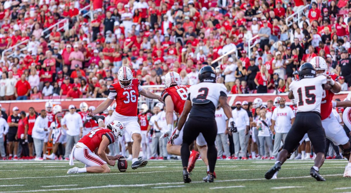 University of Utah kicker Cole Becker (36) and holder Jack Bouwmeester (34) in the home opener football game against Southern Utah University at Rice-Eccles Stadium in Salt Lake City on Thursday, Aug. 29, 2024. (Photo by Samantha Lazenby | The Daily Utah Chronicle)