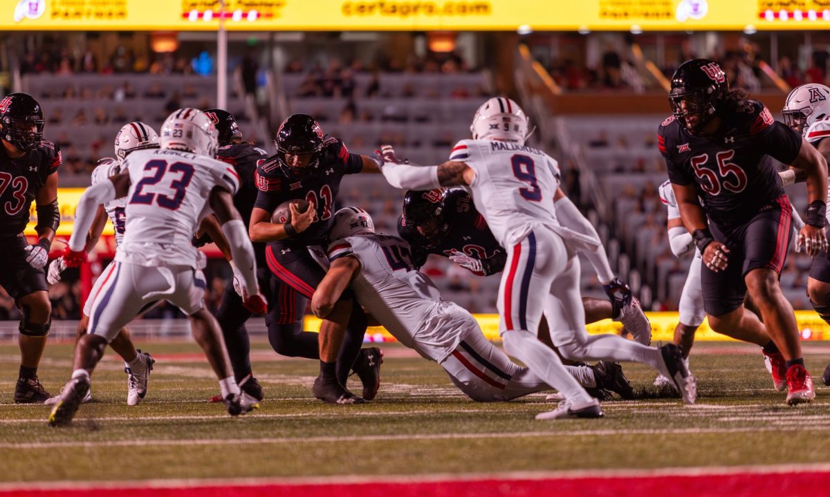 University of Utah freshman quarterback, Isaac Wilson (11), at the NCAA football game against the University of Arizona at Rice-Eccles Stadium in Salt Lake City on Saturday, Sept. 28, 2024. (Photo by Samantha Lazenby | The Daily Utah Chronicle)